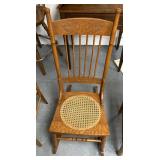 Vintage wooden rocker with wicker pattern seat