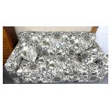 Floral patterned couch with hide a bed