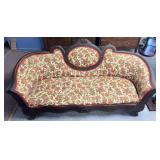 Vintage floral patterned couch needs some work