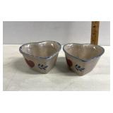 Two heart themed pottery bowls