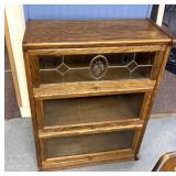bookcase with receding glass doors.