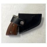 Fold up knife with holder