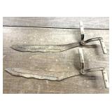 2 primitive hay saws