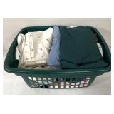 Laundry basket with sheets and linens