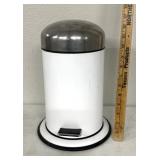 Small bathroom, trash container