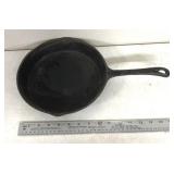 Unmarked cast-iron skillet