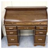 Roll top desk has scratches/marks