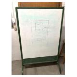 rolling dry erase board with a green frame