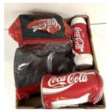 Coca-Cola Bag, water jug, and towel