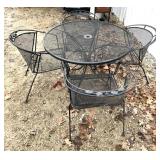 Metal patio table with four matching chairs