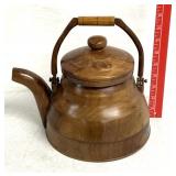 vintage-style tea kettle, is crafted from wood