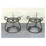 pair of round glass-top side tables with