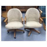 2 wooden chairs with rollers cushion