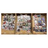 Three flats of sleeve football cards