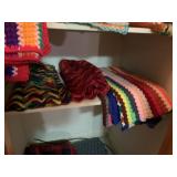 Afgans, etc in Hall Closet