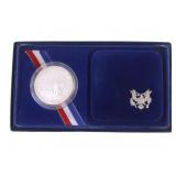 1986 US ELLIS ISLAND SILVER DOLLAR COIN