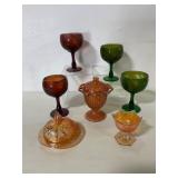 Assorted Glassware With Amber and Green Tones
