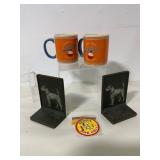 Lot of Two Mugs, Bookends, and Sticker