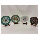 Four Christmas Plates With Stands