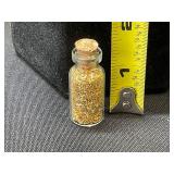 Glass Vial with Gold-Colored Flakes