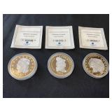 Three Platinum-Accented Coin Replicas
