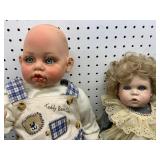 Two Porcelain Dolls with Clothing