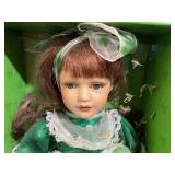 Four Porcelain Dolls with Boxes