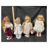 Four Porcelain Dolls with Stands