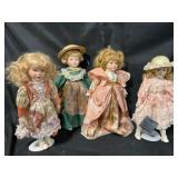 Four Porcelain Collectible Dolls