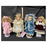 Four Porcelain Dolls with Tags