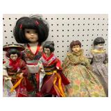 Five Asian and Porcelain Dolls
