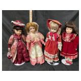 Four Porcelain Dolls in Period Costumes