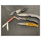 Four Folding and One Fixed Blade Knives