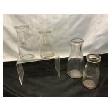 Four Glass Milk Bottles
