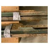 Two Bundles of Four Green Metal Rails