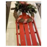 Red Wooden Sled with Wreath Decor