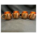Four Hammered Copper Mugs