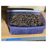 Plastic Tote Filled With 3.5-Inch Nails