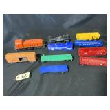 The Lionel Co 0 gauge Train engine and boxcars