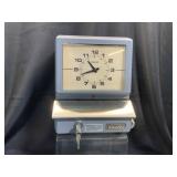 An industrial Amano mechanical time clock