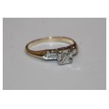 14 KT yellow gold diamond ring that features