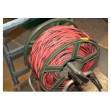 A very long reel of power cords