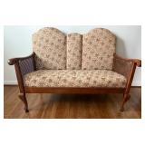 Upholstered Settee With Rattan Side Panels