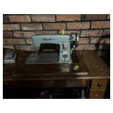 Vintage Sewing machine in cabinet