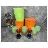 A Collection of Vintage Mid Century Modern Kitchenware and Barware including Tupperware Servalier Canisters and a Parisian Themed Cocktail Shaker