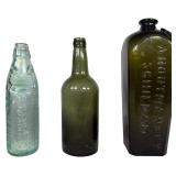 A Trio of Antique Glass Bottles including Bermuda Codd-Neck Soda and A. Houtman and Co. Case Gin