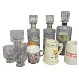 A Collection of Vintage Advertising Whiskey Decanters, Beer Steins, and Promotional Glassware