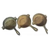 Three Miniature Cast Iron Advertising Skillet Ashtrays Including Theo. Hess & Martin and Burnham Corporation