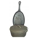 Two Lodge Cast Iron Cookware Pieces Including Dutch Oven and Large Oval Griddle