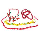 A Collection of Four Vintage Mid-Century Novelty Fruit and Red Bead Necklaces